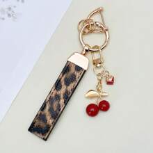 TTOBS 1pc Exquisitely Crafted Leopard Print Leather Car Key Chain With Adorable Cherry Pendant - , Fashionable And Multi-Functional Backpack Keychain - The Perfect Accessory For Backpacks. The Perfect Valentine's Day Gift, Also An Ideal Gift For Your Beloved Girlfriend.