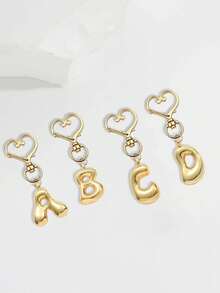Colgante de letras del alfabeto en forma de burbuja lindas charms - Colgante de cristal de la suerte, letras de amor con cierre dorado de A a Z, colgante de aleación brillante para bolso y mochila - Regalo perfecto para cumpleaños y ocasiones especiales, llavero anillo colgante para bolso mochila coche, accesorios de billetera y bolso para mujeres y niñas - Dorado - Ver 3