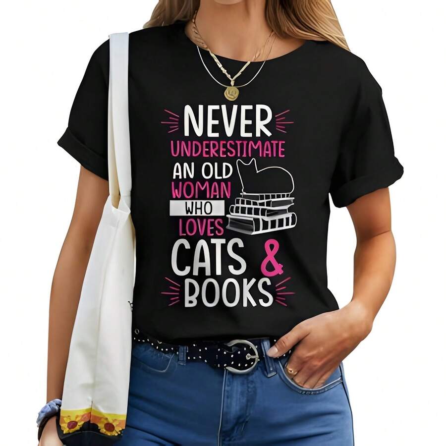 Never Underestimate An Old Woman Who Loves Cats & Books Gift Women T-Shirt _ Seseable CA220g Cotton Casual Graphic Tee Lightweight Yet Durable Crew Neck Shirt For Beach Trips, Airplane Travel, Weekend Getaways, Or Road Adventures, Stylish And Comfortable Summer Outfit With Loose Fit For Maximum Comfort, Aesthetic -Worthy Graphic Tee For Photos And Reels - Black - View 1