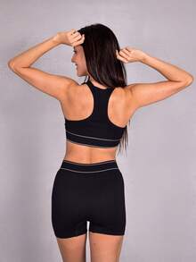 Conjunto deportivo para mujer con short y top cómodo 2 piezas, ideal para entrenamiento en gym, yoga y actividades fitness. Diseño ajustado, transpirable y flexible para moverte con total libertad. - Negro - Ver 7