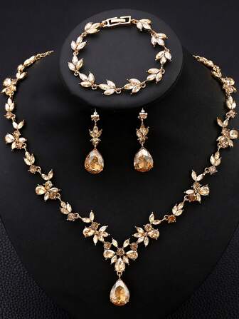 一套 4 件时尚优雅的合金水钻玻璃项链、耳环和手链首饰，适合女性婚礼、宴会、舞会和派对