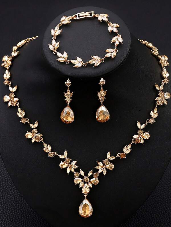Un conjunto de 4 piezas de joyería elegante y de moda de aleación con rhinestones y vidrio, incluyendo collar, aretes y pulsera, adecuado para bodas, banquetes, bailes y fiestas de mujeres