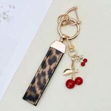 TTOBS 1pc Exquisitely Crafted Leopard Print Leather Car Key Chain With Adorable Cherry Pendant - , Fashionable And Multi-Functional Backpack Keychain - The Perfect Accessory For Backpacks. The Perfect Valentine's Day Gift, Also An Ideal Gift For Your Beloved Girlfriend.