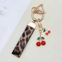TTOBS 1pc Exquisitely Crafted Leopard Print Leather Car Key Chain With Adorable Cherry Pendant - , Fashionable And Multi-Functional Backpack Keychain - The Perfect Accessory For Backpacks. The Perfect Valentine's Day Gift, Also An Ideal Gift For Your Beloved Girlfriend.