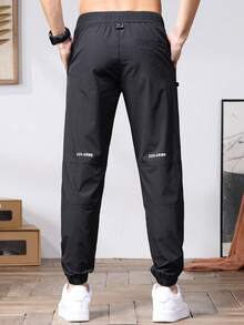Męskie spodnie haremowe z elastyczną talią i kieszeniami, swobodne, oddychające, uniwersalne spodnie męskie do wypoczynku - Czarne - Zobacz 4