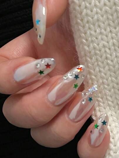 Ten Long Almond-Shaped Handmade Press-On Nail Tips That Can Be Pressed And Attached. These Pearlescent White Press-On Nails Are Decorated With Colorful Stars And Rhinestones, Shining Brightly.