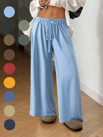 飘逸阔腿裤：轻盈梭织面料搭配弹力抽绳腰带，修身显瘦，是通勤、购物和居家休闲的必备单品。新款春秋季女式休闲裤，适合约会、学生和日常出行。百搭风格，休闲、海滩等场合皆可穿着。抽绳腰带设计，适合外出和居家穿着。