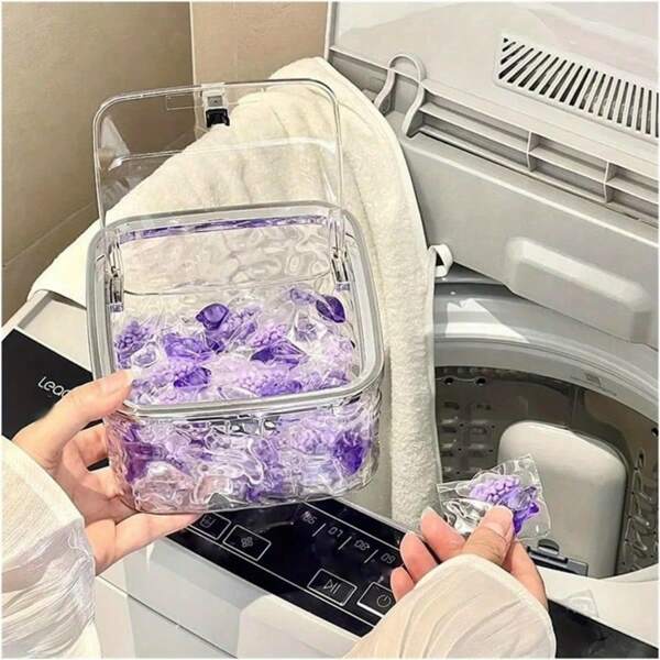 1 transparante plastic wascapsuledispenser met opklapbaar deksel - Geschikt voor meer dan 120 wascapsules, apart opbergbakje voor wasmiddel en kralen, artistieke woondecoratie, opbergdoos voor de wasruimte, badkamerbenodigdheden, badkameraccessoires, badkamerorganizer, terug naar school