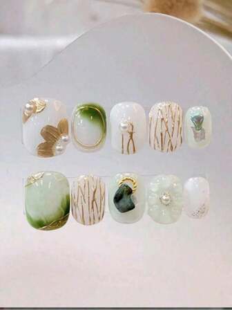 10 stuks handgemaakte ronde press-on nagels, met de focus op de verfrissende, elegante en mysterieuze tinten cyaan. De driedimensionale lijnpatronen zijn gedeeltelijk verborgen en onthullen een gevoel van kleur, waardoor de vingertoppen een verlengstuk van emoties worden. Ze zijn afneembaar en herbruikbaar, geschikt voor dagelijks gebruik en feestelijke gelegenheden voor vrouwen met verschillende stijlen.