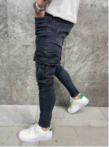 Jeans negros lavados de corte skinny y elástico de unicolor para hombre