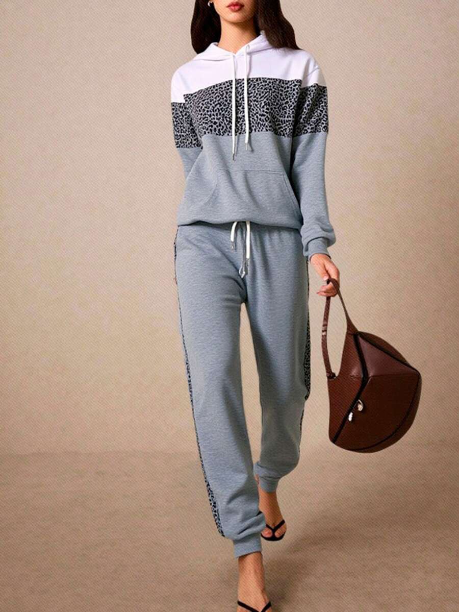 Conjunto de pants afelpado, deportivo y casual para mujer, tela de poliéster y spandex, ideal para temporadas de otoño e invierno, sudadera con bolsillo de canguro y capucha, pantalón semi-entubado, con resorte en la bota, ajuste de cintura natural con resorte y cordón para mayor ajuste, con bolsillos frontales funcionales. - Gris - Ver 1