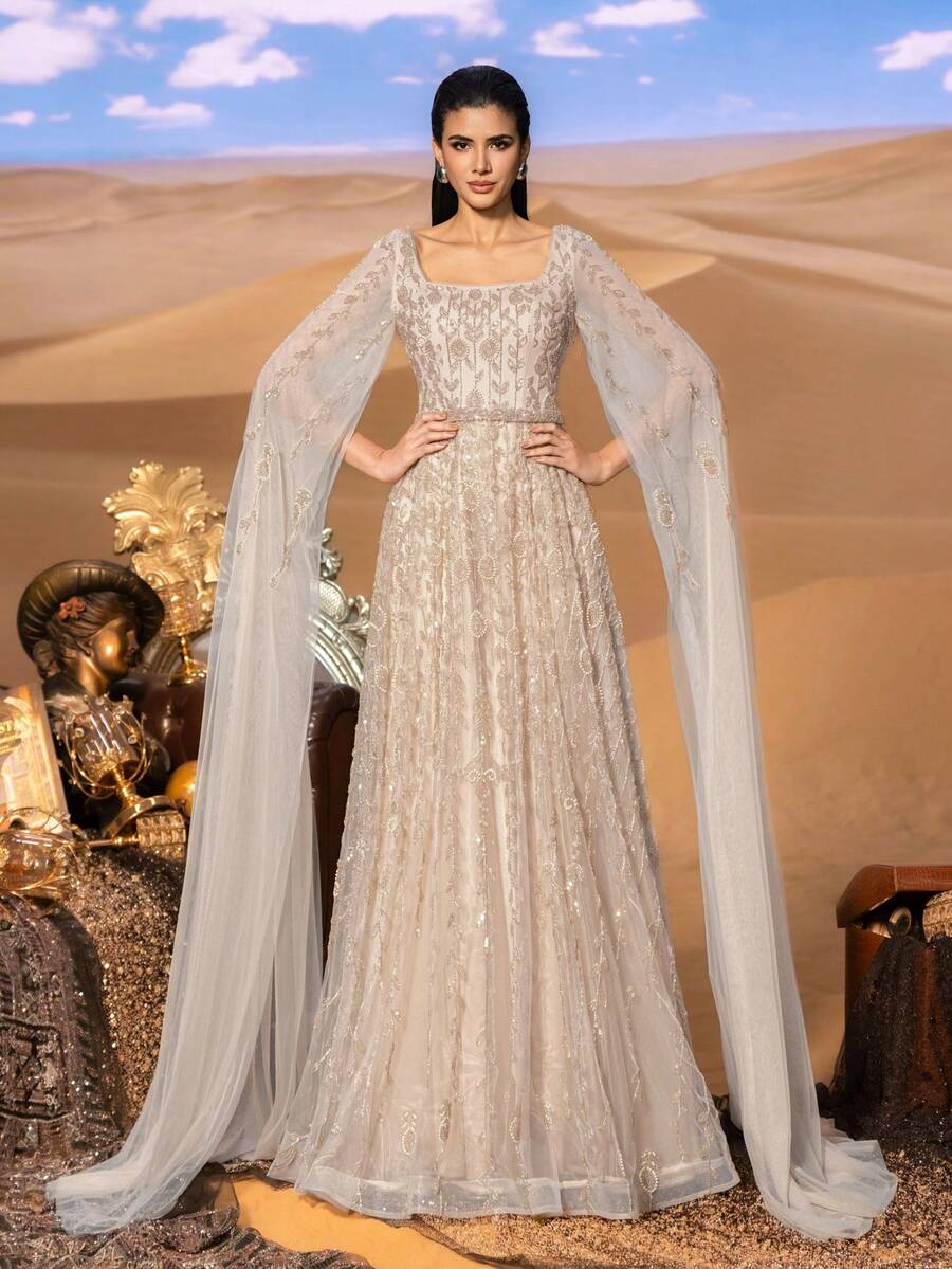 Faeriesty Đầm dạ hội lấp lánh quyến rũ, được tô điểm bằng những họa tiết thêu đính cườm và tay áo voan mỏng, thiết kế cổ vuông, phù hợp cho các sự kiện thảm đỏ, dạ tiệc lấy cảm hứng từ Trung Đông và tiệc cưới sang trọng. Thích hợp cho tiệc cưới, dạ hội, tiệc tùng, thanh lịch, mùa xuân. - Rượu sâm banh - Xem 1