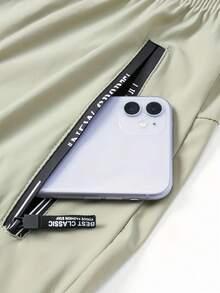 男士轻便透气弹力跑步裤，夏季款，带拉链口袋和抽绳腰带，采用柔软舒适的冰丝面料，纯色运动裤，适合日常穿着、户外活动、健身、度假、休闲垂钓等场合。 - 卡其色 - 查看 7