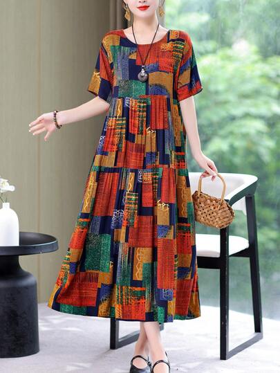 Đầm dài ngang gối in họa tiết thời trang mùa hè mới, kiểu dáng thanh lịch, thích hợp cho nữ đi nghỉ mát.