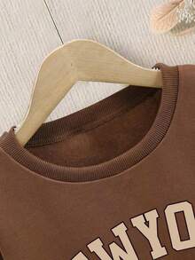 青少年女孩卡通图案印花圆领长袖上衣和格子裙