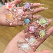 10 pièces Pendentif de tortue de mer lumineux et pailleté, breloques à thème anime sous emballage opaque en acrylique, convient pour créations de bijoux, colliers, boucles d'oreilles, porte-clés, décoration intérieure et extérieure, sans alimentation électrique, idéal pour Noël, Pâques, Thanksgiving, décoration de tortue de mer
