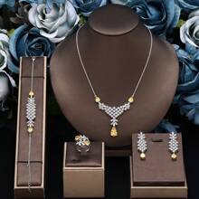 Ensemble de bijoux en zirconium goutte d'eau pour femmes. Comprend un collier, des boucles d'oreilles, un bracelet et une bague. 4 pièces de bijoux de mariée