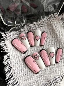 Dieses 10 Stücke Set im niedlichen Comic-Stil verfügt über eine mittellange Sarg-Form mit handbemalten schwarzen Konturen. Die Kombination aus Pink und Weiß wird durch handgemalte Herzflammen ergänzt, was einen verspielten und hochwertigen Charme verleiht. Die tragbare Panzerung ist wiederverwendbar und kommt mit Jelly-Gel und einer Feile. Geeignet für Damen und Mädchen, auch Schülerinnen und schwangere Frauen können es verwenden. Für Partys, den Alltag, Schulen usw.