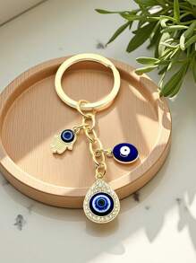 1 pieza Llavero estilo europeo y americano con colgante de mano, gota de agua, ojo del diablo, accesorio adecuado para accesorios de ropa de mujer y hombre, adornos de bolso y accesorios de coche