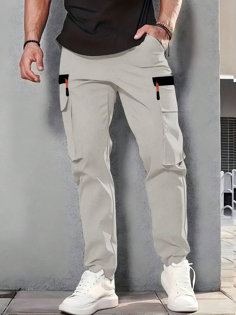 男士户外徒步、钓鱼、露营、登山、健身、跑步及休闲时尚工作裤，带拉链口袋、弹性腰带、斜插口袋、直筒裤型，灰色运动款