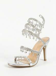Tacones de aguja de punta abierta con tira de moda plateada, con aplicación de cristal en forma de serpiente, apropiados para verano y otoño, ideales para el Día de San Valentín