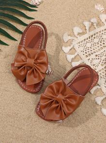 1 Pair Brown Toddler Girls' Flat Sandals, Solid Color PU, Bow Decor Elastic Backstrap, Open Toe, Roman Style Casual Beach Sandals Suitable For 3-15 Years Old Girls, Summer New Arrival