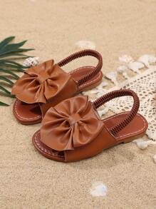 1 Pair Brown Toddler Girls' Flat Sandals, Solid Color PU, Bow Decor Elastic Backstrap, Open Toe, Roman Style Casual Beach Sandals Suitable For 3-15 Years Old Girls, Summer New Arrival