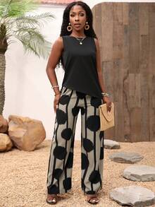 Set de 2 piezas: Top asimétrico sin mangas de unicolor y pantalones largos con estampado floral