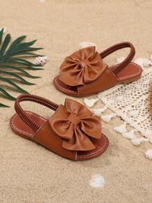 1 Pair Brown Toddler Girls' Flat Sandals, Solid Color PU, Bow Decor Elastic Backstrap, Open Toe, Roman Style Casual Beach Sandals Suitable For 3-15 Years Old Girls, Summer New Arrival