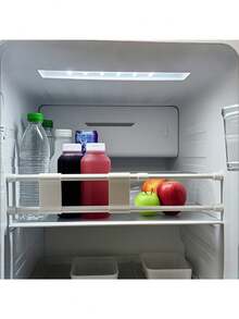 The Overhead Storage Cabinet Railing In The RV Helps Prevent Items From Falling. The RV Home Refrigerator Extendable Rod Extends The Storage Shelf And Can Be Adjusted. The Simple Fixed Rack Has A Kitchen Storage Organizer With Partition Design Inside The Cabinet.