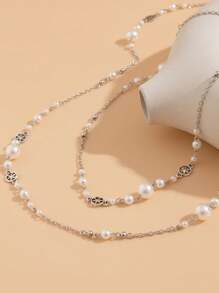1 set de 2 colliers superposés de style chic et luxueux avec faux perles, chaîne de chandail vintage à gland, collier long à pendentif avec fleur ajourée. Convient pour le port quotidien, les vacances et les fêtes pour les femmes.