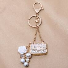 rongji jewelry Llavero de bolso con flor de cristal de Rhinestone con colgante de bolso con cristal brillante y dije de perla falsa para mujeres