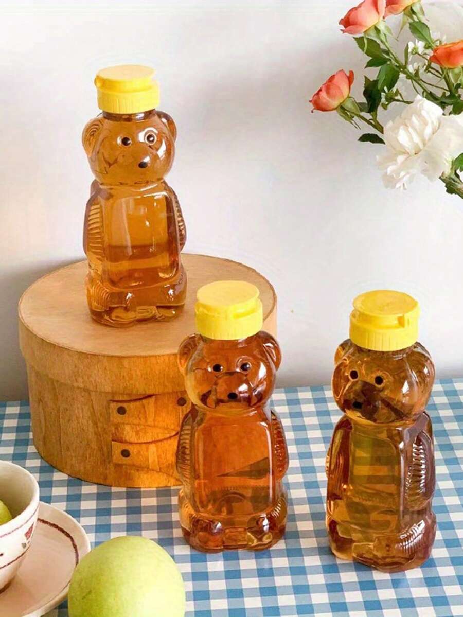 1/2/4 pièces bouteille en plastique ours miel vide, bouteille de pressage de miel, tasse en forme d'ours miel en vrac avec couvercle rabattable jaune. Contenants de bocal à miel pour stocker et distribuer le miel et les jus