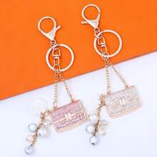 rongji jewelry Llavero de bolso con flor de cristal de Rhinestone con colgante de bolso con cristal brillante y dije de perla falsa para mujeres