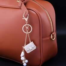rongji jewelry Llavero de bolso con flor de cristal de Rhinestone con colgante de bolso con cristal brillante y dije de perla falsa para mujeres