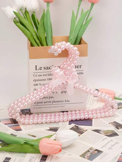 1pc Of Faux Pearl Hanger With A Bow, Faux Pearl Pants Clip, And Pet Hanger. The Hanging Clothes Support Is Suitable For Hanging Fairy-Style Clothing Items Like Dresses, Trousers, Shoes, Jeans, Boots, And Skirts. It's Suitable For A Minimalist Style In Spring And Can Also Be Used For Summer Tops (These Pearls Are Made Using The Processes Of Plastic Electroplating And Powder Spraying, And There May Be Some Slight Scratches And Cracks.)