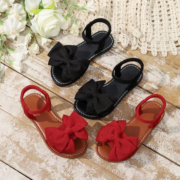 Mädchen Segeltuch Sandalen, Sommer 2025 Neue weiche Sohle Schleifen Dekor Riemen Flache Sandalen, modische süße Outdoor-Slides