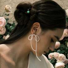 1 par de pendientes con diseño de lazo y borla de perlas falsas hechos a mano, elegantes y delicados, apropiados para uso diario y atuendos de viaje