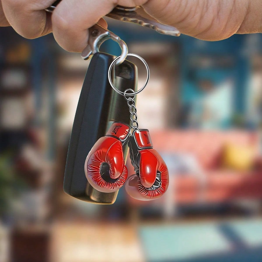 2 pieces car keychains decorated with a boxing glo...