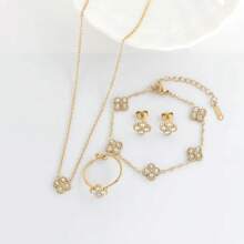 Conjunto de joyas de acero inoxidable 316L con flores doradas incrustadas de piedras de circonita, incluyendo collar, pendientes, pulsera y anillo, un conjunto de joyas para niñas que no se desvanece