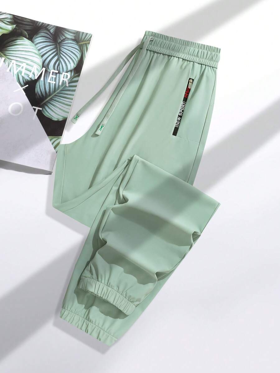 1pc Women's Lightweight Ice Silk Sports Pants, Breathable Quick-Dry, With Ankle Cuffs, Drawcord Waist, Zipper Pockets, Suitable For Outdoor Activities And Casual Walking