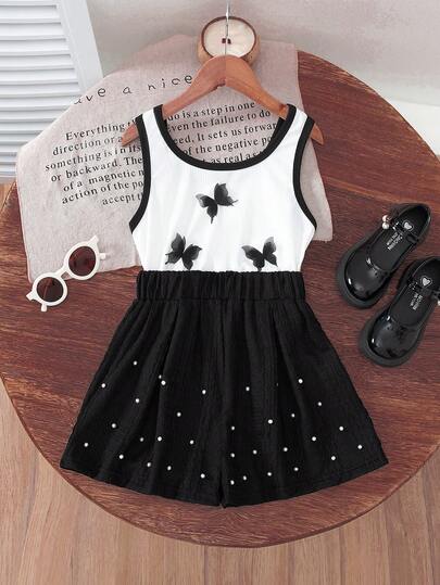 女孩时尚夏季套装，白色拼色蝴蝶时尚上衣 + 纹理黑色珍珠装饰短裤，别致休闲装，适合女孩日常穿着