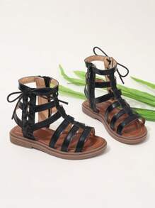 Sandalias romanas de moda para niñas con tira alta, nueva versión del verano 2025, zapatos de princesa estilo coreano, suela suave y cómoda, zapatos de playa para niños de talla media/grande