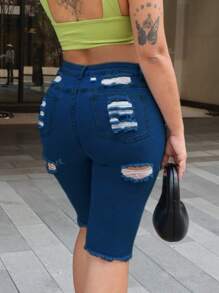 Pantalones cortos de mezclilla con dobladillo crudo desgarrado