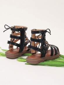 Sandalias romanas de moda para niñas con tira alta, nueva versión del verano 2025, zapatos de princesa estilo coreano, suela suave y cómoda, zapatos de playa para niños de talla media/grande