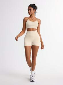 TCVC Set de 2 piese sutien sport + pantaloni scurți pentru femei, fără cusături, culoare solidă, foarte elastici, transparenti, rezistenti la uzură, acoperire ridicată, absorbție a șocurilor, încrețituri, căptușeală independentă, bretele subțiri sexy, spate frumos, talie înaltă, control al abdomenului, șolduri piersică, pantaloni scurți de ciclism versatili, culoare solidă, potriviți pentru alergare, yoga, sală de sport, activități în aer liber, timp liber, recreere - alb - Vizualizare 2