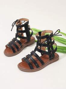 Sandalias romanas de moda para niñas con tira alta, nueva versión del verano 2025, zapatos de princesa estilo coreano, suela suave y cómoda, zapatos de playa para niños de talla media/grande