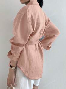 Blusa casual y de moda de color liso con hombros sueltos y anudada en la parte delantera para primavera y otoño
