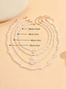 Conjunto de 4 collares elegantes y vintage con perlas falsas, estrellas de mar, conchas y vieiras de múltiples capas, adecuados para bikini, playa y uso diario