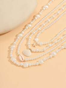 Conjunto de 4 collares elegantes y vintage con perlas falsas, estrellas de mar, conchas y vieiras de múltiples capas, adecuados para bikini, playa y uso diario